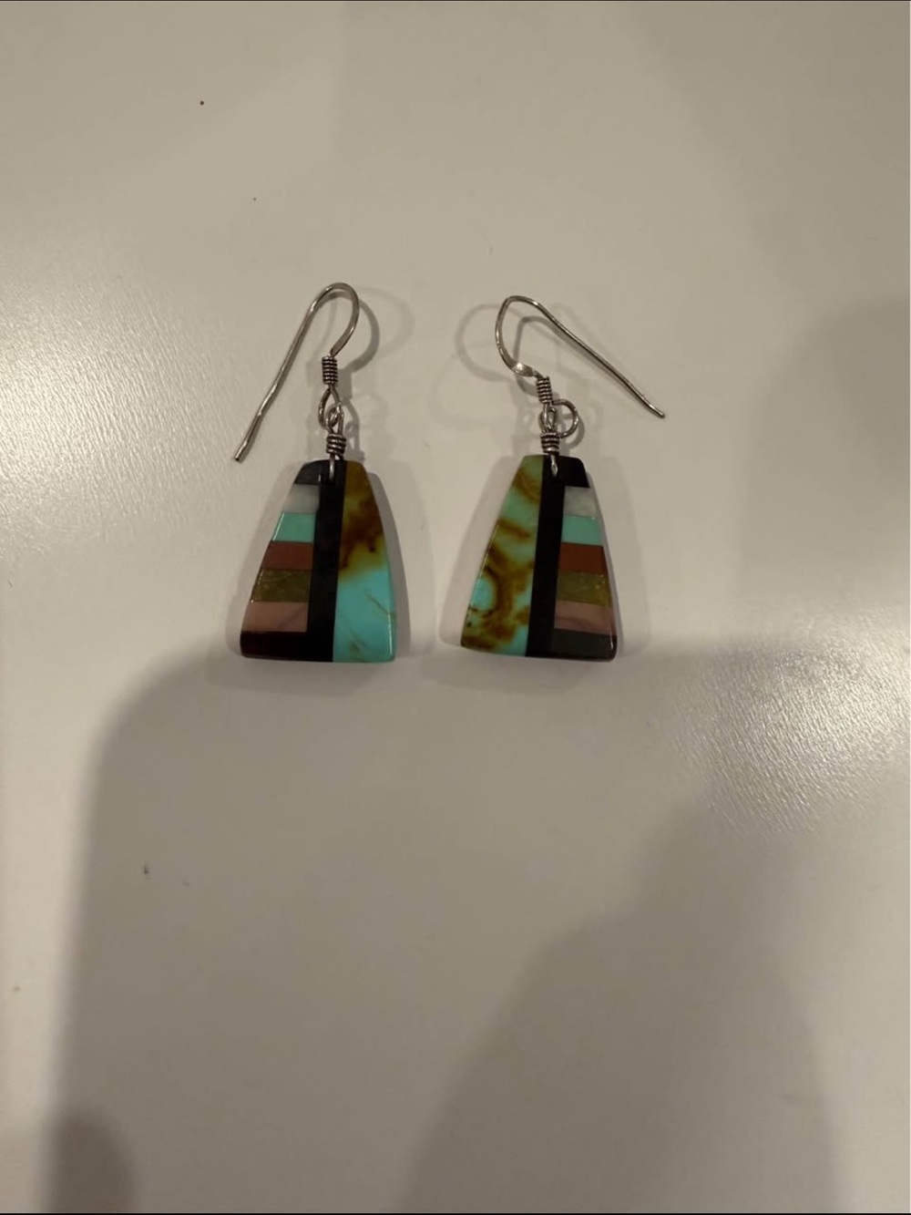Sterling silver dangle earrings feature mosaic inlay